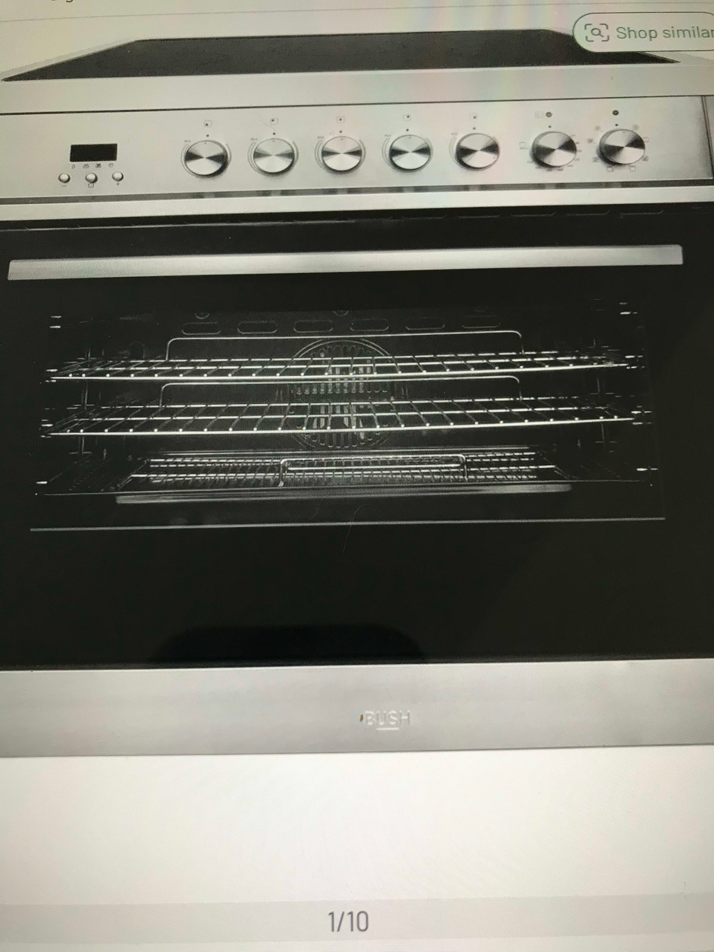 Built-in electric oven with multiple racks and controls